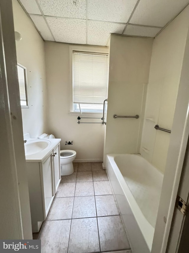 106 S Overbrook Ave, Trenton, NJ 08618 - bathroom with vanity, toilet, tile patterned floors, a drop ceiling, and baseboards