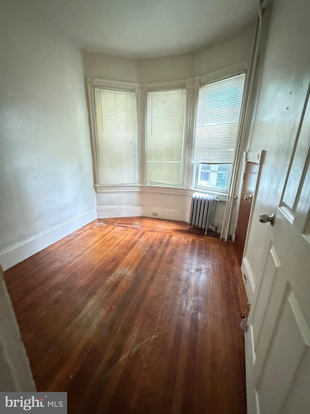 106 S Overbrook Ave, Trenton, NJ 08618 - spare room featuring radiator, hardwood / wood-style flooring, and baseboards