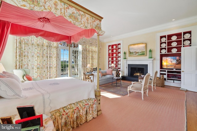 bedroom with crown molding, access to outside, and wood-type flooring