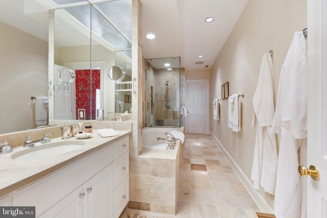 bathroom with independent shower and bath and vanity