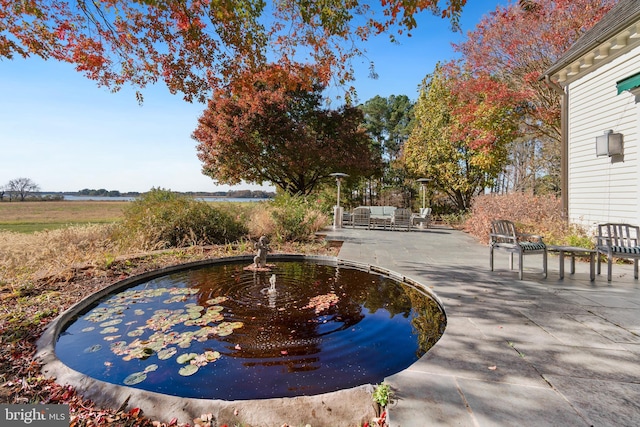 view of home's community featuring a patio area and outdoor lounge area