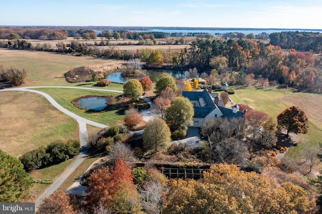 birds eye view of property with a water view and a rural view