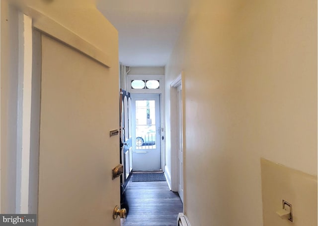 corridor featuring dark hardwood / wood-style flooring