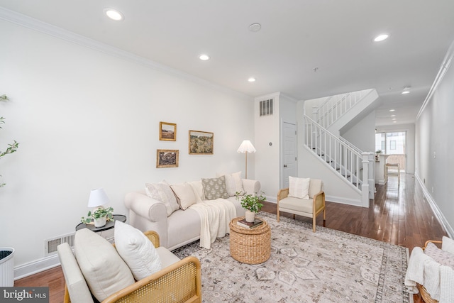 living area with visible vents, stairway, ornamental molding, wood finished floors, and recessed lighting