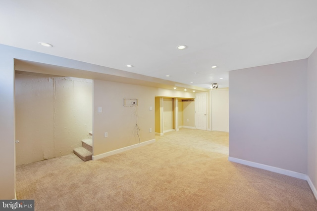 basement with light colored carpet