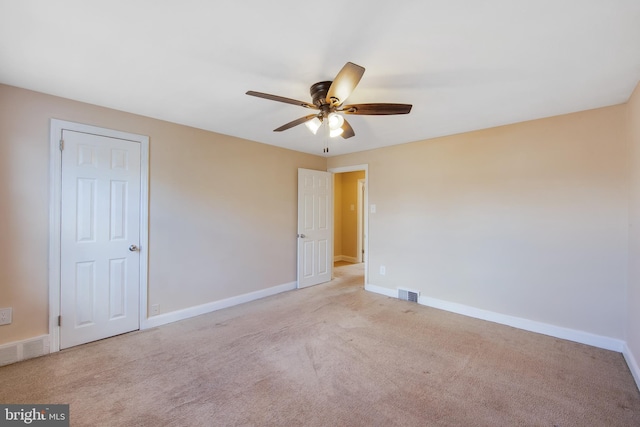 carpeted empty room with ceiling fan