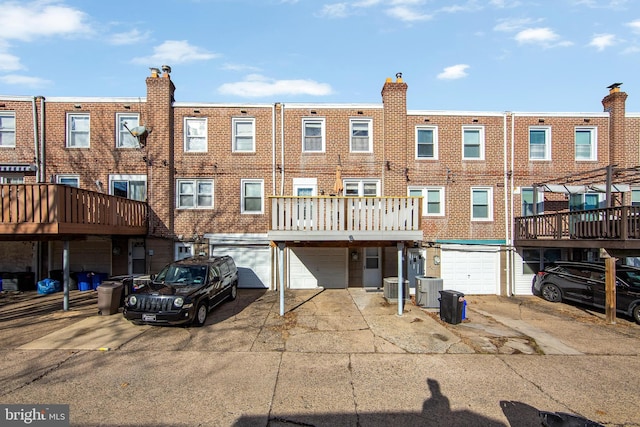 back of house featuring central AC