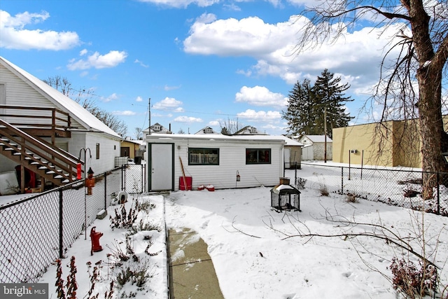 view of snow covered house