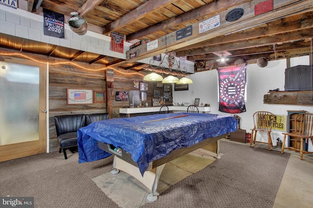 recreation room with beam ceiling and billiards