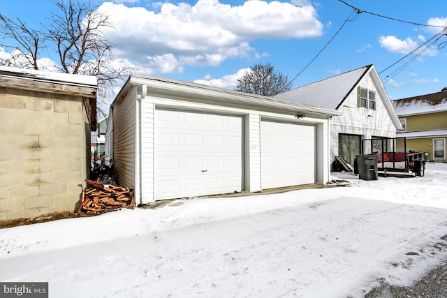 view of snow covered garage