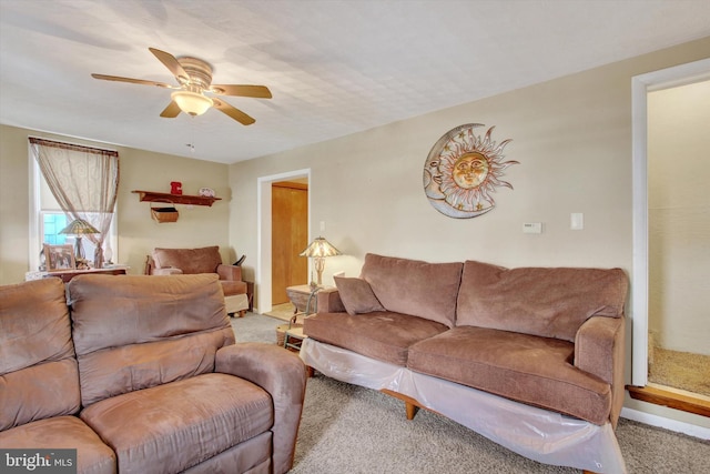 living room with light colored carpet and ceiling fan