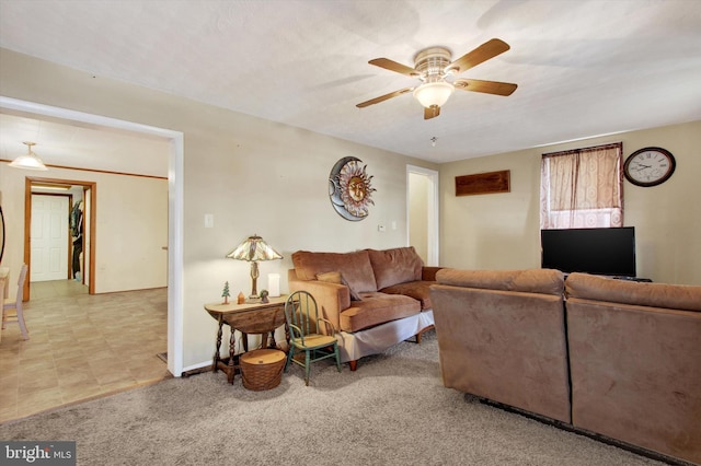 carpeted living room featuring ceiling fan