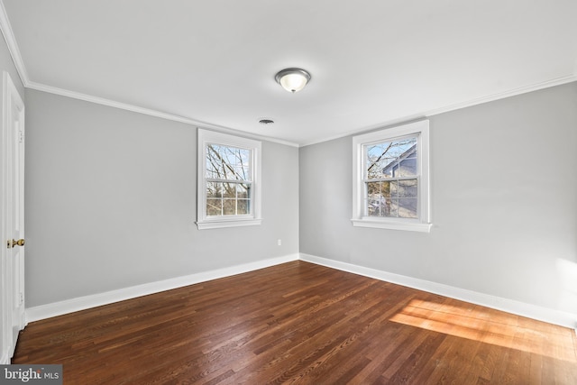 unfurnished bedroom featuring ornamental molding, dark wood-style flooring, and baseboards