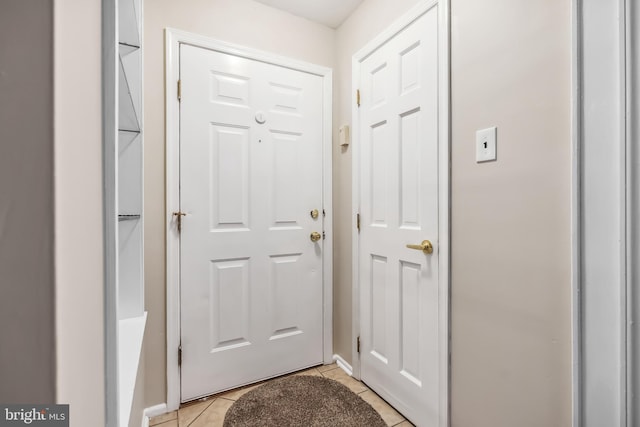 entryway featuring light tile patterned floors