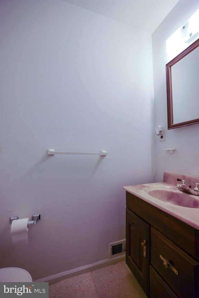 bathroom with vanity and tile patterned flooring