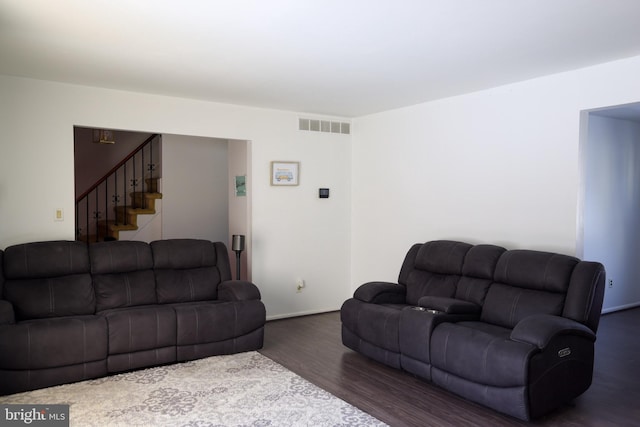 living room featuring dark wood-type flooring