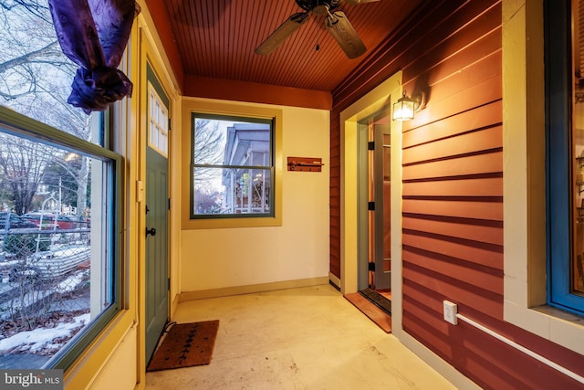 interior space featuring wooden ceiling and ceiling fan