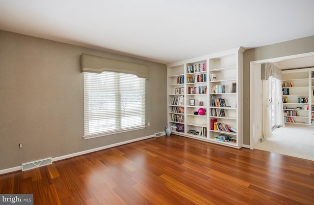 empty room featuring wood-type flooring