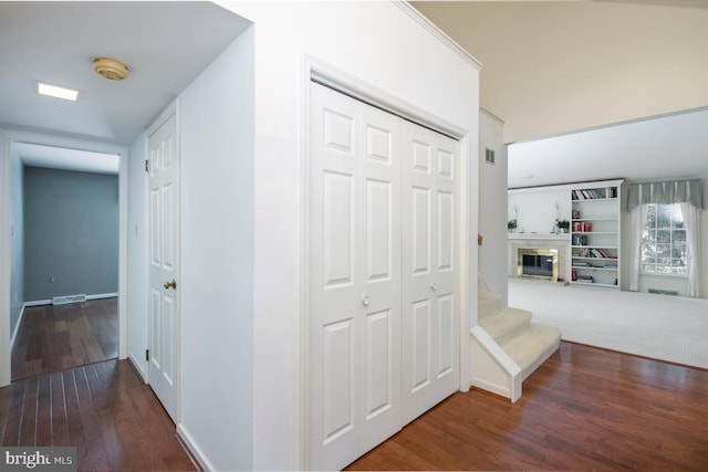 hall with hardwood / wood-style flooring