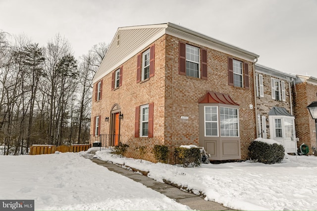 view of snow covered property