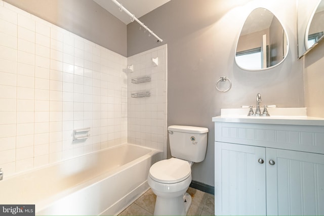 full bathroom with tile patterned flooring, vanity, toilet, and tiled shower / bath