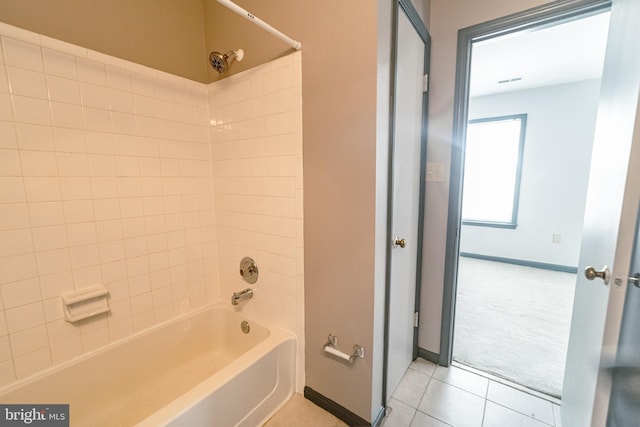 bathroom featuring tile patterned flooring and shower / bath combination