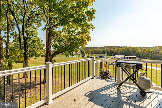 wooden deck with a lawn