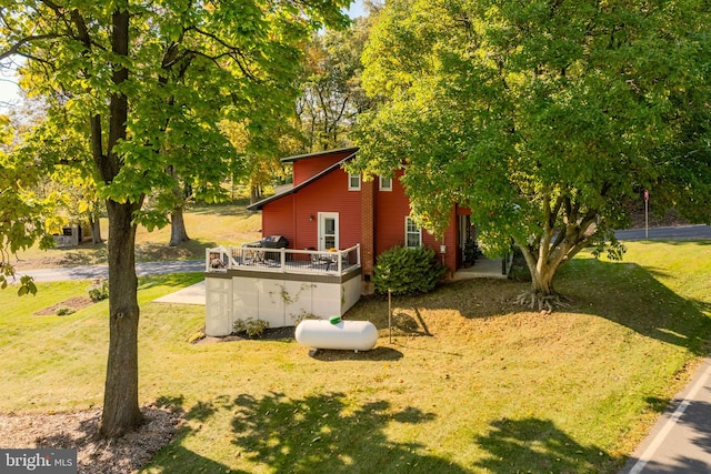 view of yard with a deck