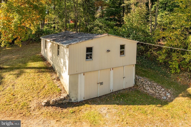 view of outdoor structure with a yard