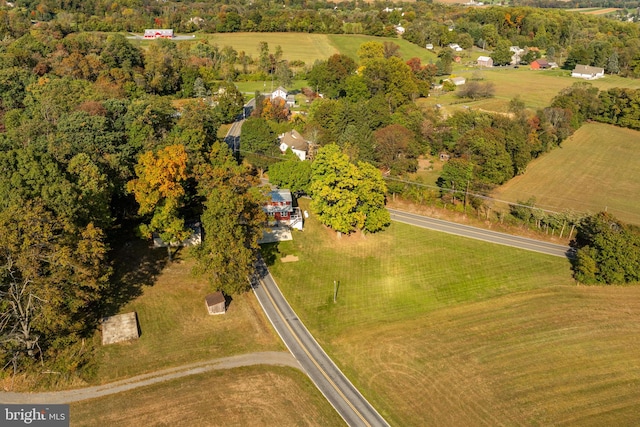 birds eye view of property with a rural view