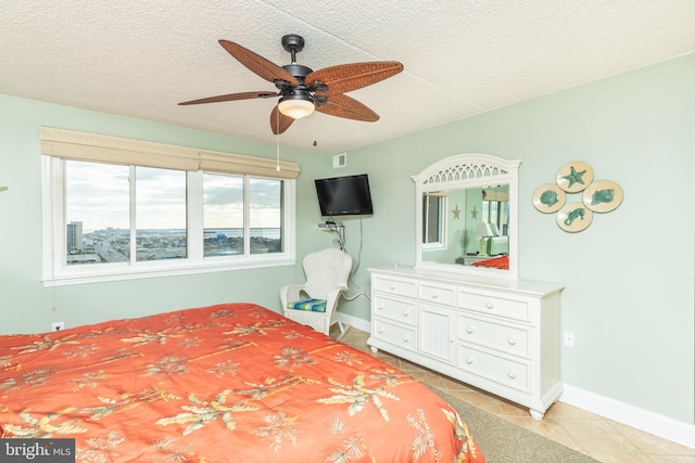 tiled bedroom with ceiling fan