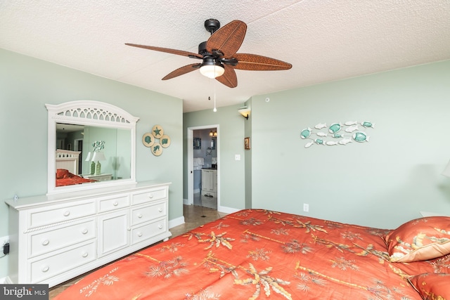 bedroom with ceiling fan and a textured ceiling