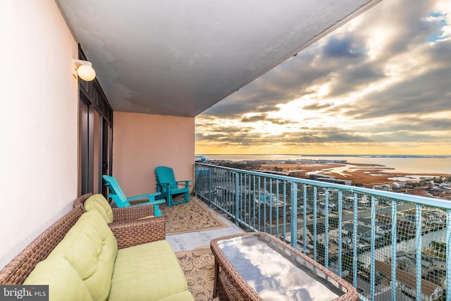 balcony at dusk with a water view