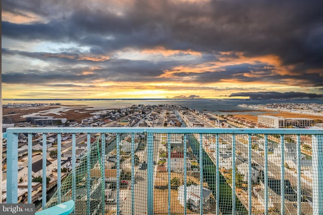 view of balcony at dusk