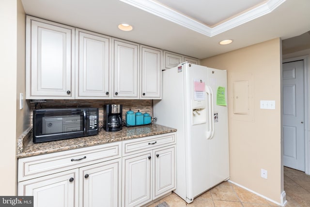 kitchen featuring white cabinetry, white fridge with ice dispenser, tasteful backsplash, crown molding, and stone countertops