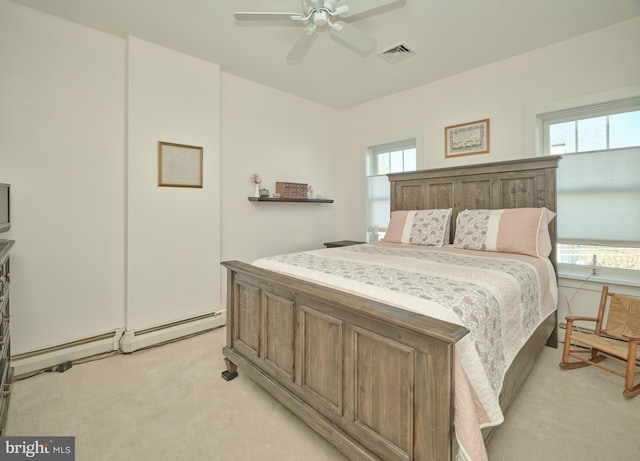 carpeted bedroom featuring ceiling fan and multiple windows