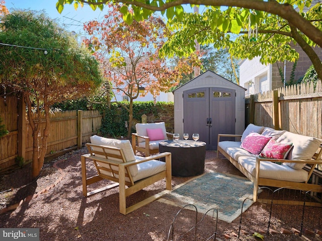 view of patio with outdoor lounge area and a storage unit