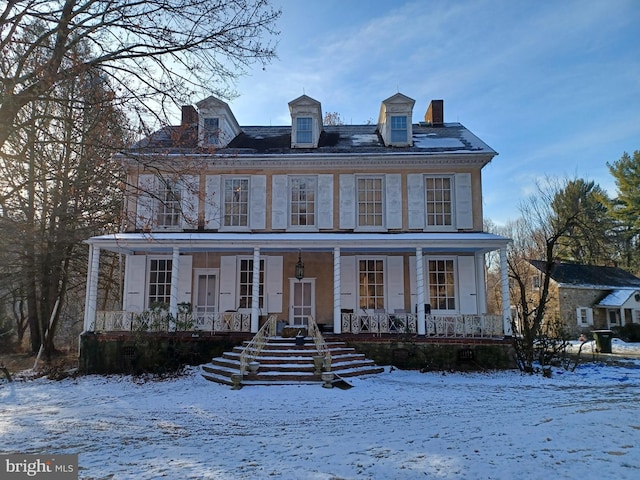 colonial-style house with a porch