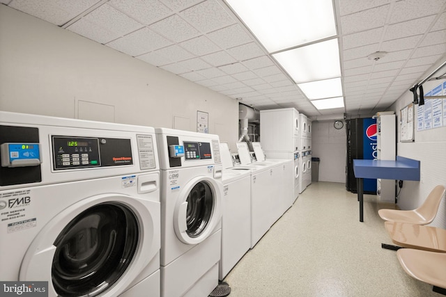 laundry room with washer and clothes dryer and stacked washer / drying machine