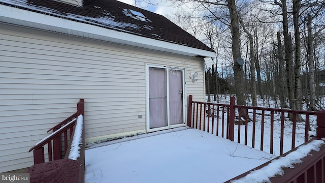 view of snow covered property entrance