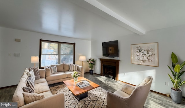 living room with beamed ceiling and light hardwood / wood-style floors