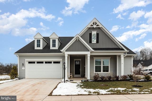 view of front of home with a porch and a garage