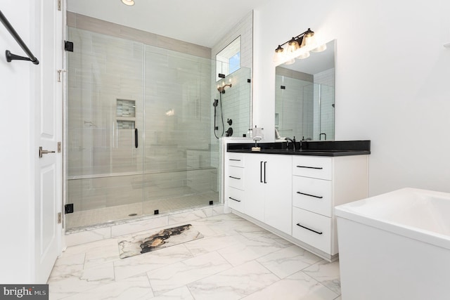 bathroom featuring vanity and a shower with shower door