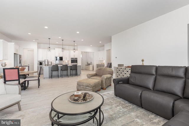 living room with light hardwood / wood-style flooring