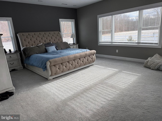 bedroom featuring light carpet