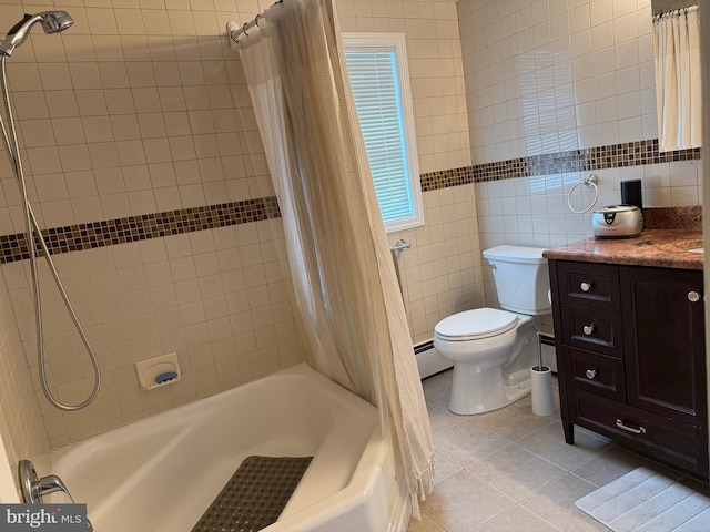 full bathroom with tile patterned flooring, tile walls, toilet, vanity, and shower / tub combo