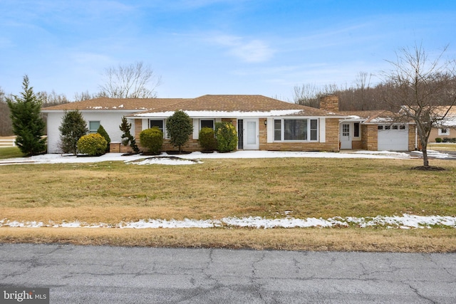 ranch-style house with a front lawn and a garage