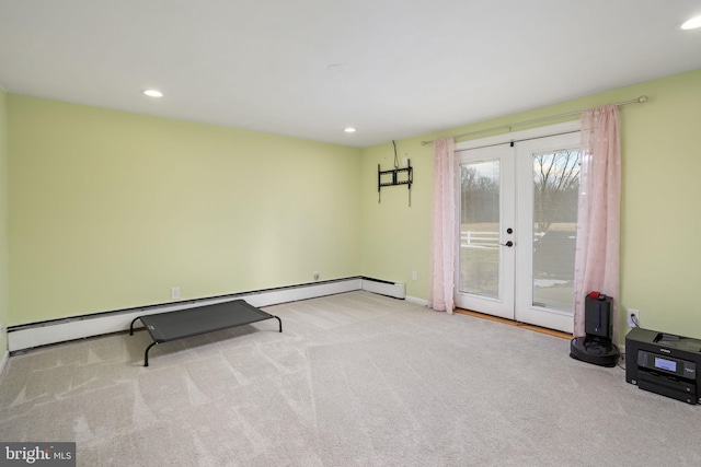 workout room featuring light colored carpet, baseboard heating, and french doors