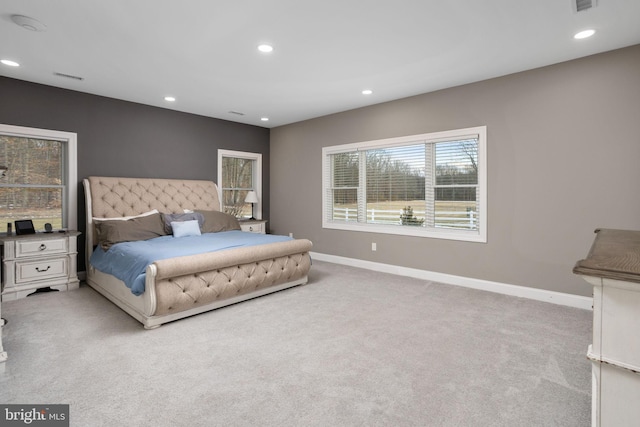 bedroom featuring light colored carpet