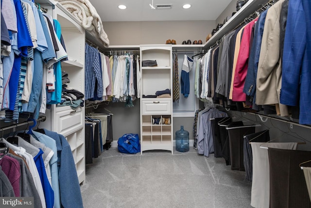 spacious closet with light colored carpet